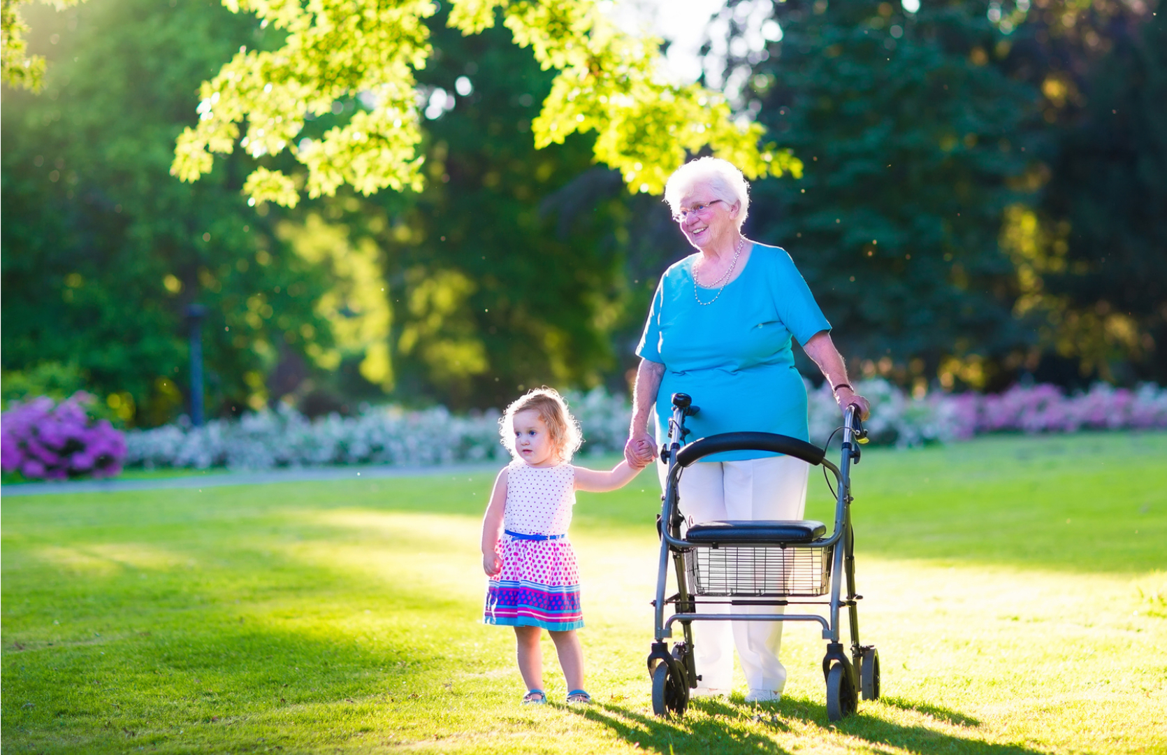 A woman and child walking in the grass